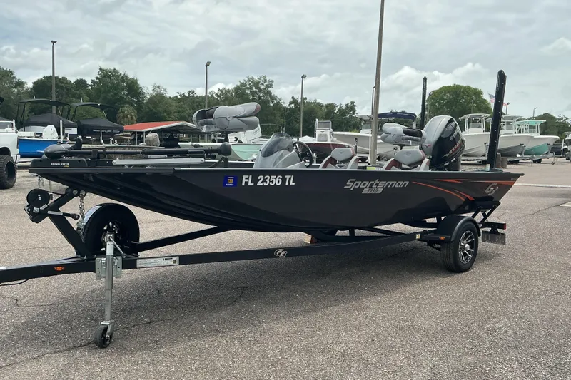Slide: The Image of 2023 G3 Sportsman 1710 boat on trailer, parked outdoors, overcast sky. - 4
