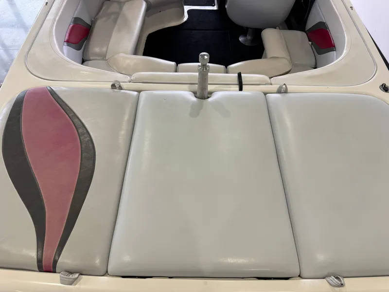 Slide: The Image of Interior of a 2001 Tigé 21 V boat with gray and red seating. - 10
