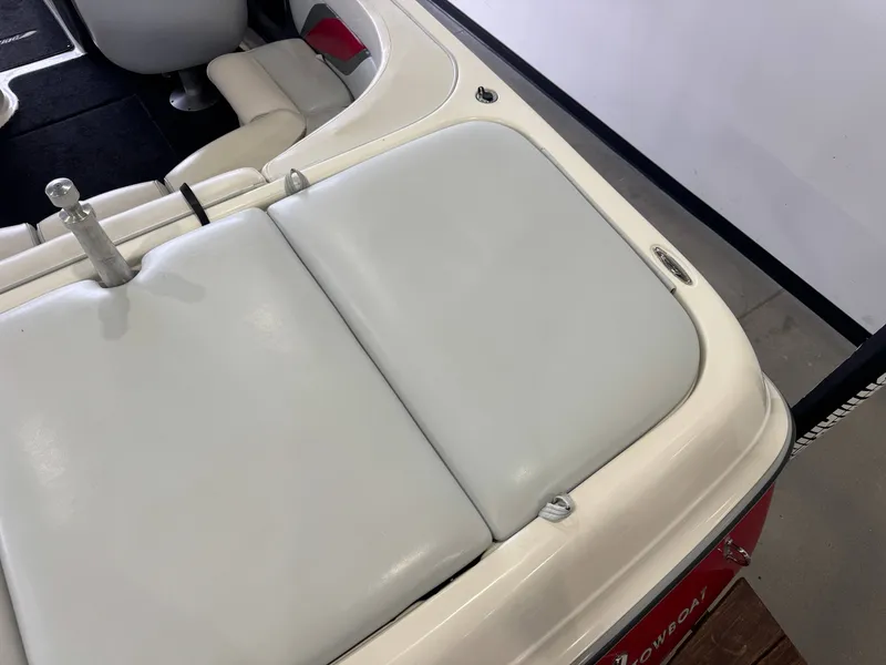 Slide: The Image of Interior of a 2001 Tigé 21 V boat with white upholstery. - 11