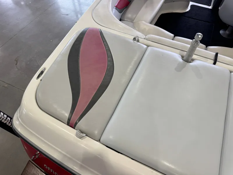 Slide: The Image of 2001 Tigé 21 V boat seat with pink and gray design. - 12