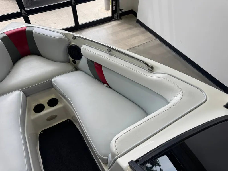 Slide: The Image of Interior of a 2001 Tigé 21 V boat with white upholstery. - 19