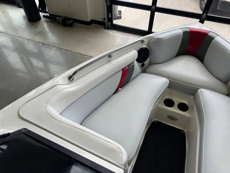 Slide: The Image of Interior of a 2001 Tigé 21 V boat with white upholstery. - 20
