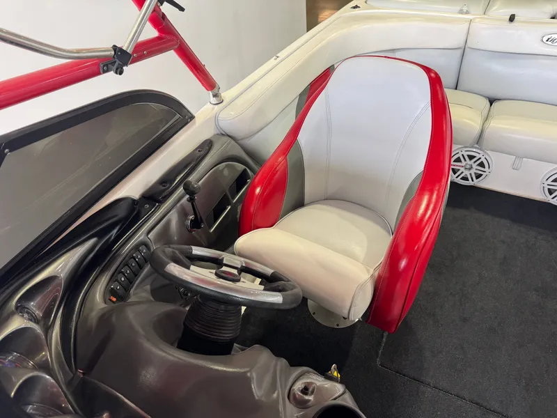 Slide: The Image of Interior of a 2001 Tigé 21 V boat with red and gray seating. - 22