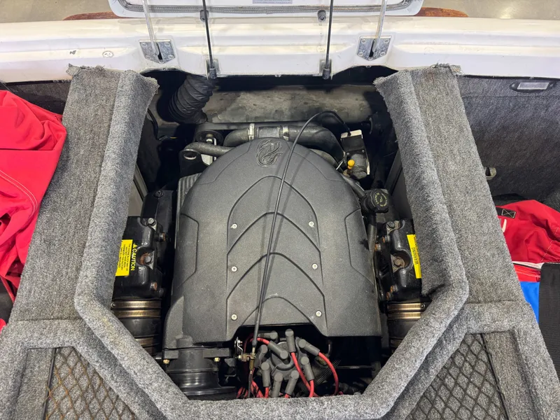 Slide: The Image of Engine compartment of a 2001 Tigé 21 V boat, well-maintained. - 28