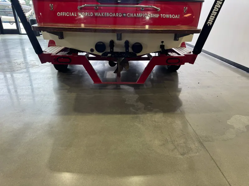 Slide: The Image of Rear view of a 2001 Tigé 21 V wakeboard boat on trailer. - 7