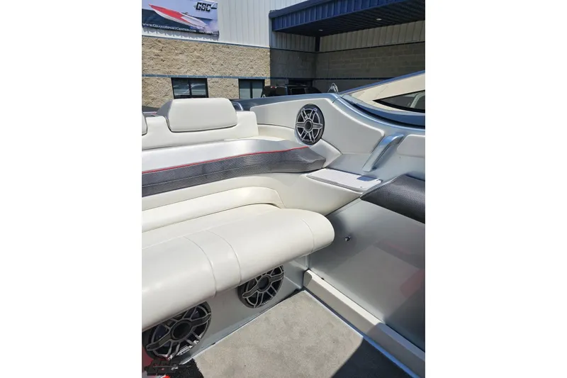 Slide: The Image of 2012 Formula 353 FASTech boat interior with white seating and speaker system. - 104