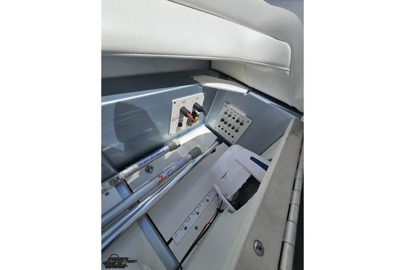 Slide: The Image of Interior view of a 2012 Formula 353 FASTech boat, showcasing control panel and storage area. - 108