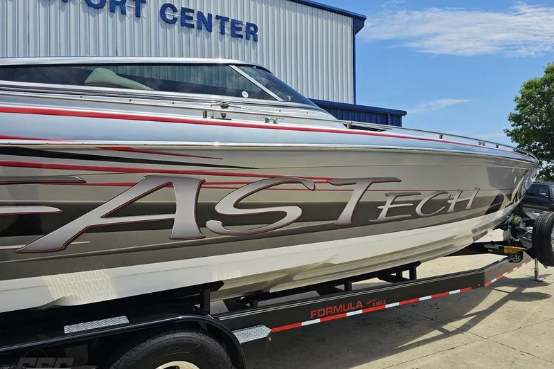 Slide: The Image of 2012 Formula 353 FASTech boat on trailer at a marine service center. - 11
