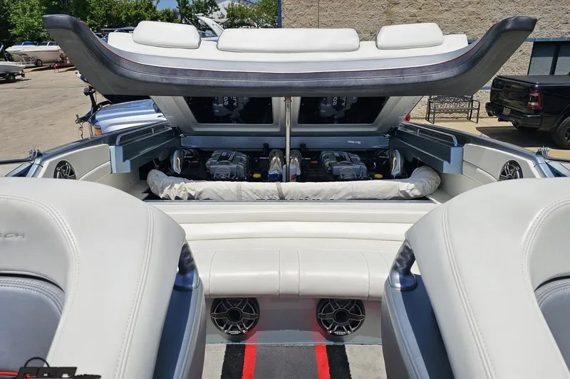 Slide: The Image of 2012 Formula 353 FASTech boat engine compartment with open hatch, showcasing dual engines. - 110