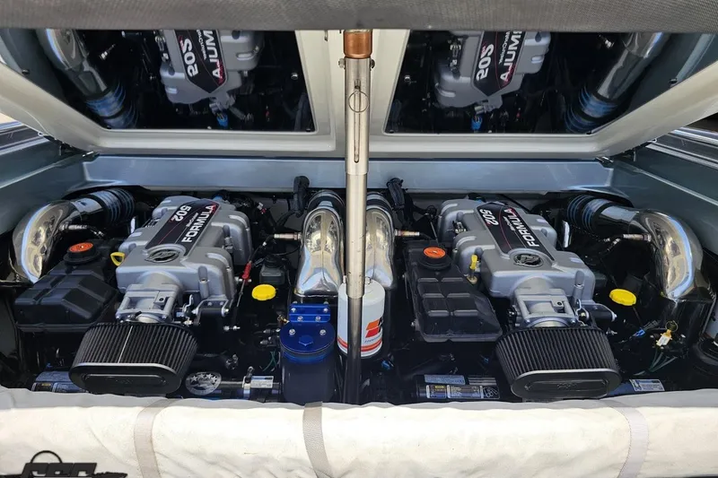 Slide: The Image of Twin engines in a 2012 Formula 353 FASTech boat, showcasing powerful performance. - 112