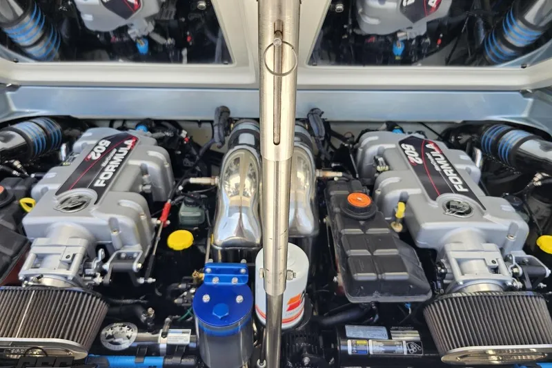 Slide: The Image of Twin engines of a 2012 Formula 353 FASTech boat, showcasing powerful performance. - 113
