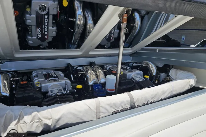 Slide: The Image of Engine compartment of a 2012 Formula 353 FASTech boat, showcasing dual powerful engines. - 114