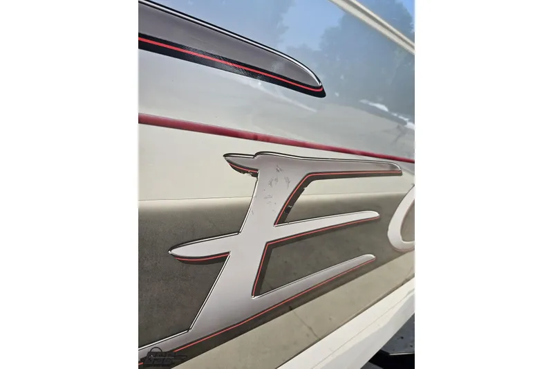 Slide: The Image of Close-up of 2012 Formula 353 FASTech boat logo with sleek red accents. - 12