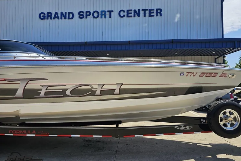 Slide: The Image of 2012 Formula 353 FASTech boat on trailer at Grand Sport Center. - 13