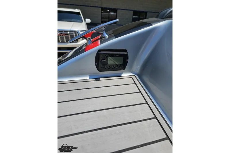 Slide: The Image of 2012 Formula 353 FASTech boat dashboard with Garmin device and sleek design. - 32