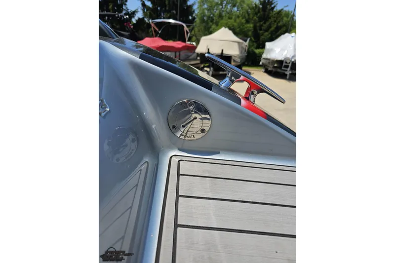 Slide: The Image of 2012 Formula 353 FASTech boat deck with waste cap and cleat in sunlight. - 34
