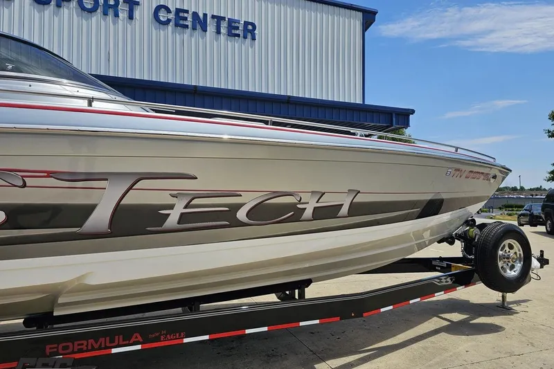 Slide: The Image of 2012 Formula 353 FASTech boat on trailer at a sport center. - 4