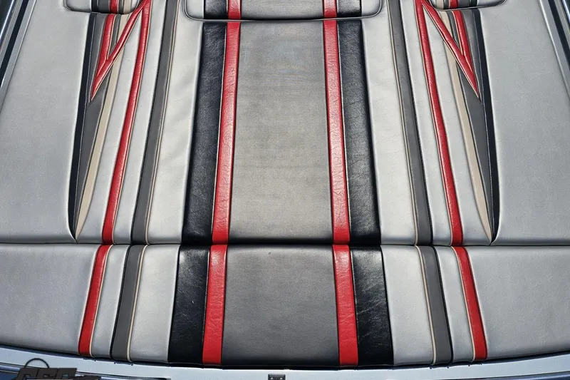Slide: The Image of 2012 Formula 353 FASTech boat seat with red, black, and gray leather upholstery. - 40