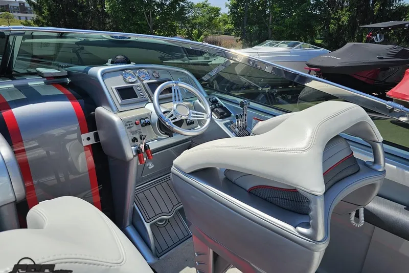Slide: The Image of Interior of a 2012 Formula 353 FASTech boat with sleek dashboard and modern controls. - 51