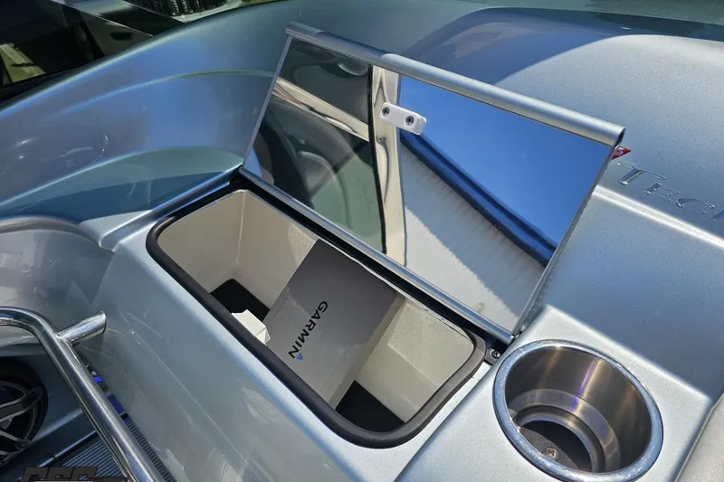Slide: The Image of Open storage compartment on 2012 Formula 353 FASTech boat with Garmin box inside. - 57