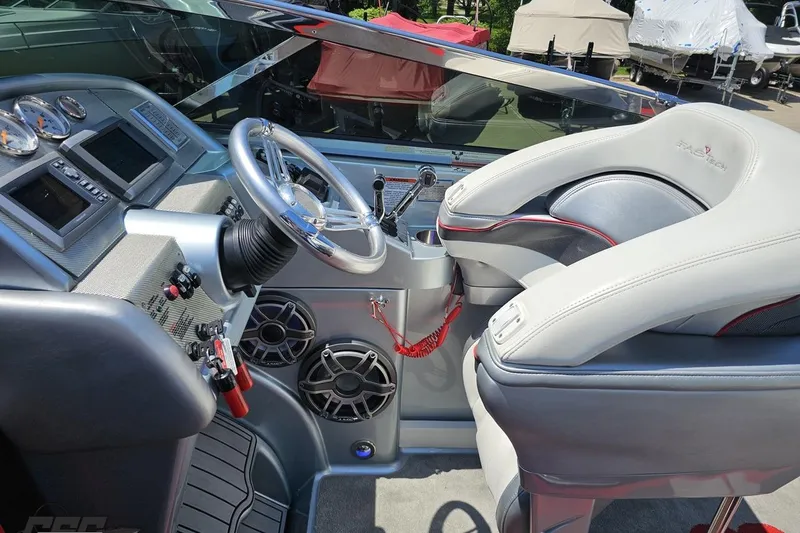 Slide: The Image of Cockpit of a 2012 Formula 353 FASTech boat with sleek controls and comfortable seating. - 59