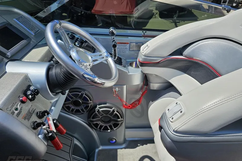 Slide: The Image of Interior of a 2012 Formula 353 FASTech boat, featuring sleek steering and controls. - 60