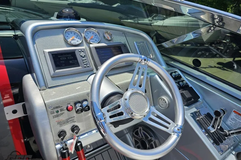 Slide: The Image of Steering console of a 2012 Formula 353 FASTech boat with gauges and controls. - 62