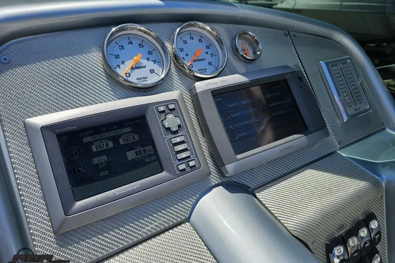 Slide: The Image of Dashboard of a 2012 Formula 353 FASTech boat with gauges and navigation screens. - 66