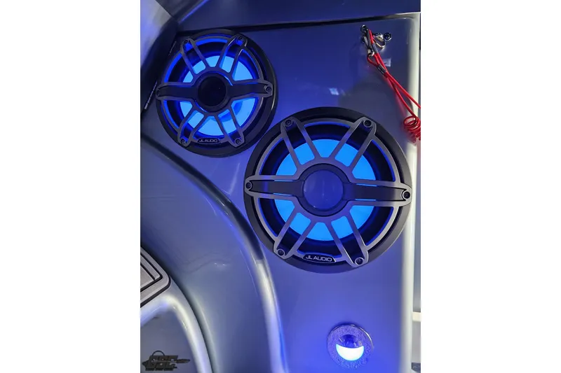 Slide: The Image of Blue LED-lit JL Audio speakers in a 2012 Formula 353 FASTech boat interior. - 72