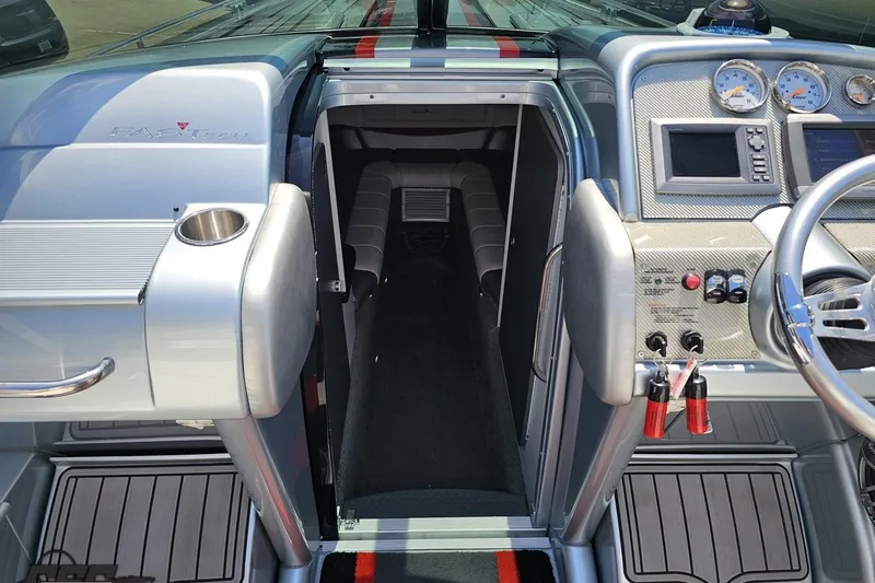 Slide: The Image of Interior view of a 2012 Formula 353 FASTech boat cockpit with gauges and seating. - 76