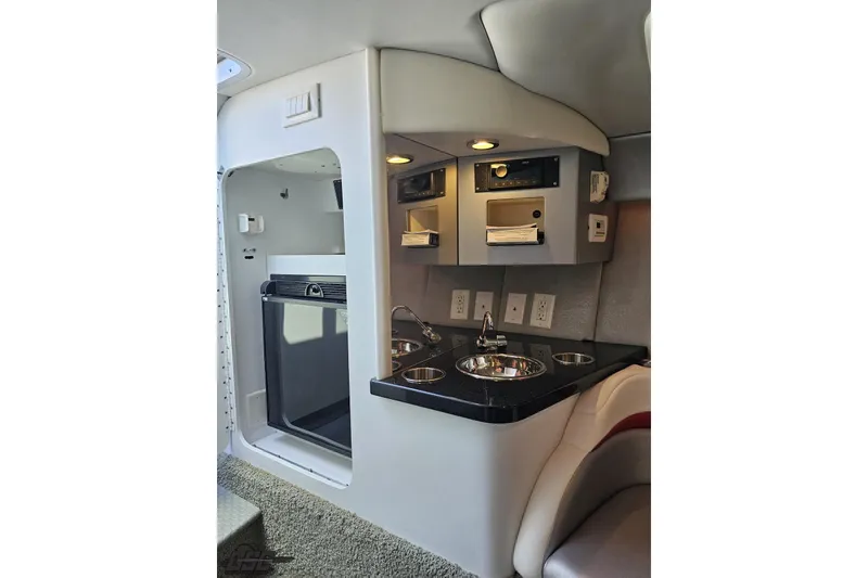 Slide: The Image of Interior of 2012 Formula 353 FASTech boat featuring kitchenette with sink and appliances. - 81