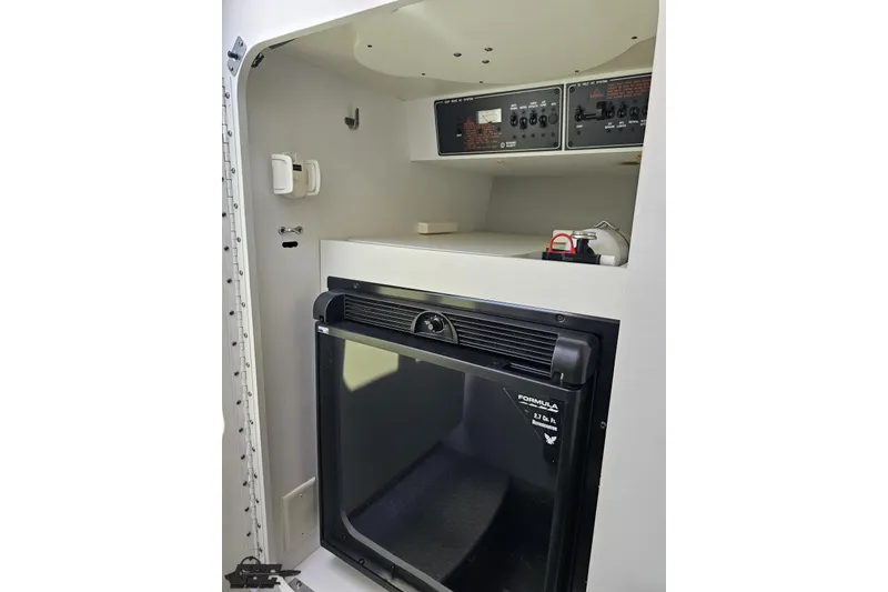 Slide: The Image of Interior of 2012 Formula 353 FASTech boat with control panels and mini fridge. - 82