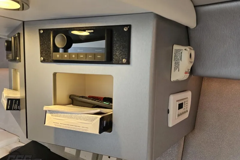 Slide: The Image of Interior of 2012 Formula 353 FASTech with control panel and storage compartment. - 83