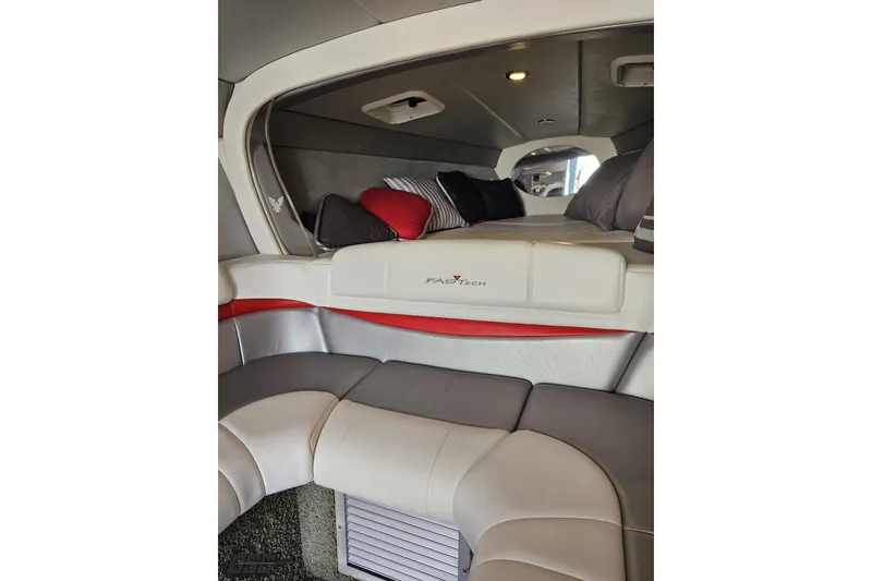 Slide: The Image of Interior of a 2012 Formula 353 FASTech boat with plush seating and cozy cabin. - 85