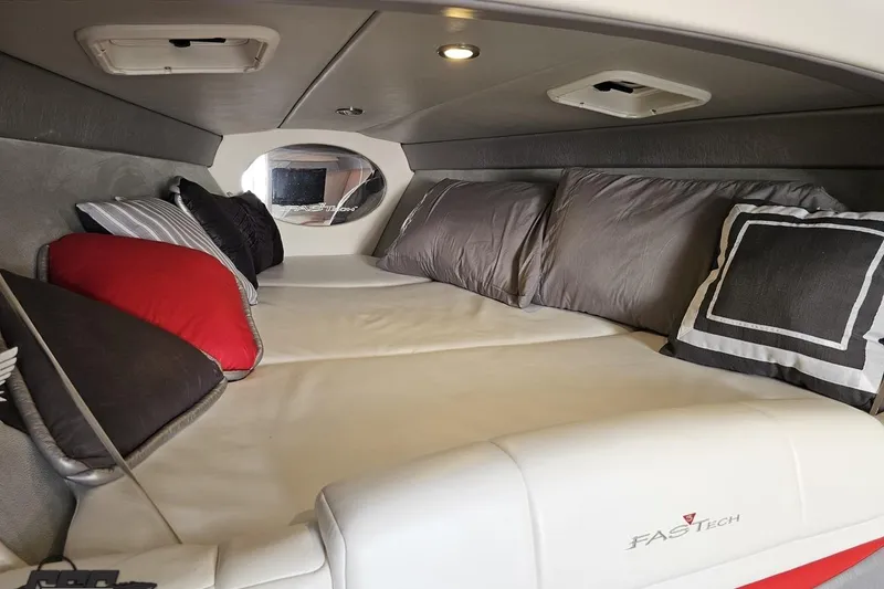 Slide: The Image of Interior cabin of 2012 Formula 353 FASTech boat with plush pillows and cozy bedding. - 86