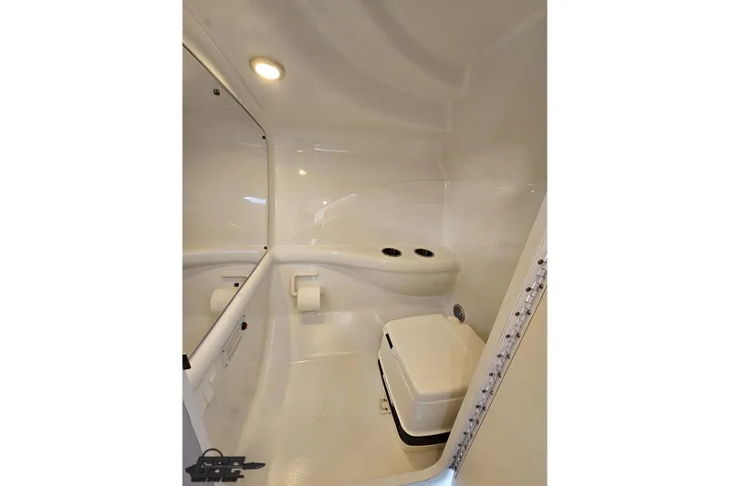 Slide: The Image of 2012 Formula 353 FASTech boat bathroom interior with compact toilet and sleek design. - 89