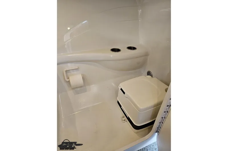 Slide: The Image of Compact bathroom in 2012 Formula 353 FASTech boat with portable toilet and paper holder. - 90