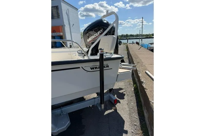 Slide: The Image of 2021 Boston Whaler 170 Montauk boat with Mercury engine docked by the waterfront. - 12