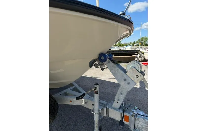 Slide: The Image of 2021 Boston Whaler 170 Montauk boat on trailer, close-up view. - 13