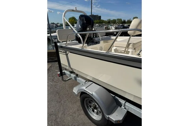 Slide: The Image of 2021 Boston Whaler 170 Montauk boat on trailer, dockside view. - 3