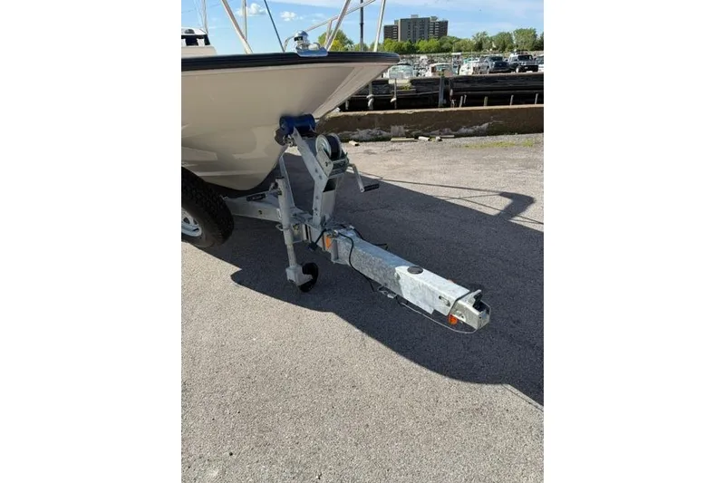 Slide: The Image of 2021 Boston Whaler 170 Montauk boat on trailer, parked near marina. - 4