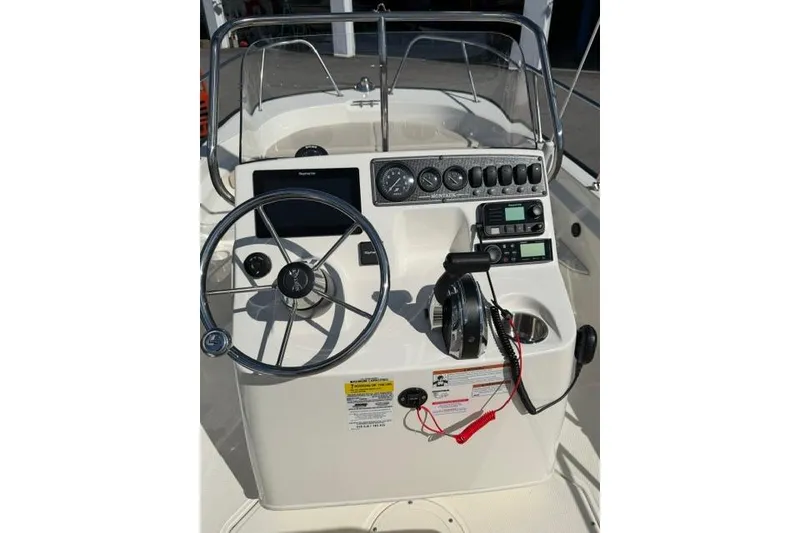 Slide: The Image of 2021 Boston Whaler 170 Montauk boat console with steering wheel and gauges. - 6