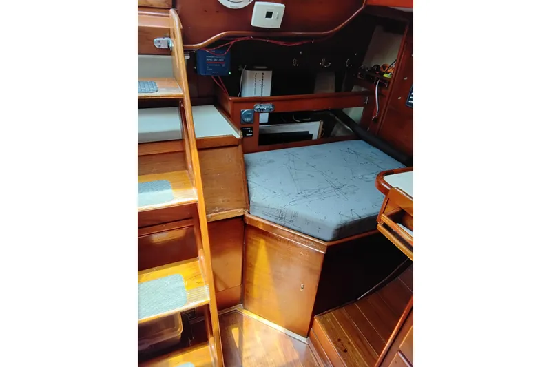 Slide: The Image of Interior of 1986 Sabre 38 sailboat with wooden steps and navigation station. - 15