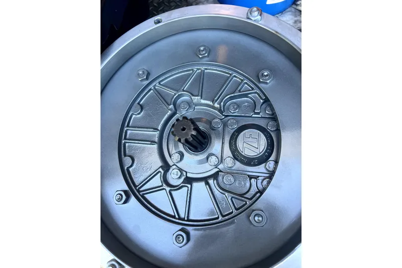 Slide: The Image of Close-up of a 1986 Sabre 38 engine component with visible gear and bolts. - 20