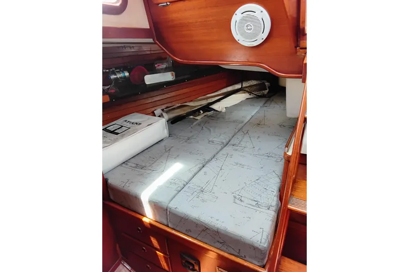 Slide: The Image of Interior cabin of a 1986 Sabre 38 sailboat with nautical-themed cushions. - 22