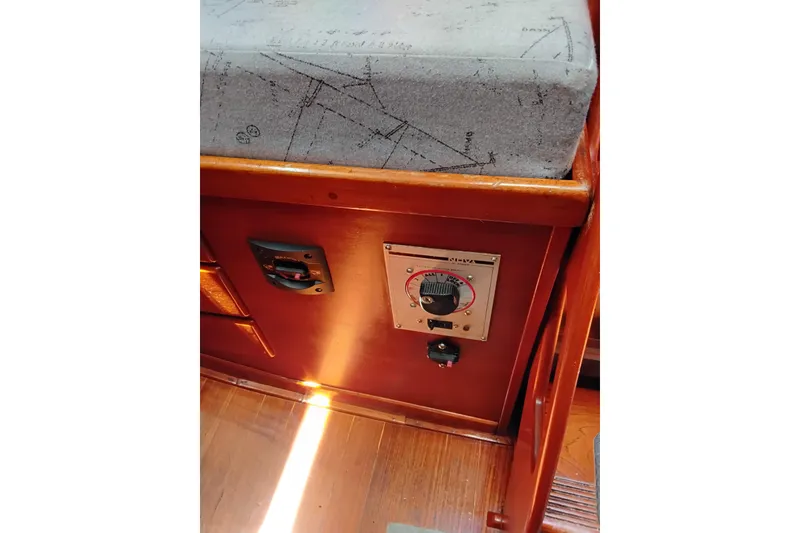 Slide: The Image of Interior of 1986 Sabre 38 sailboat showing control panel and wooden finish. - 23