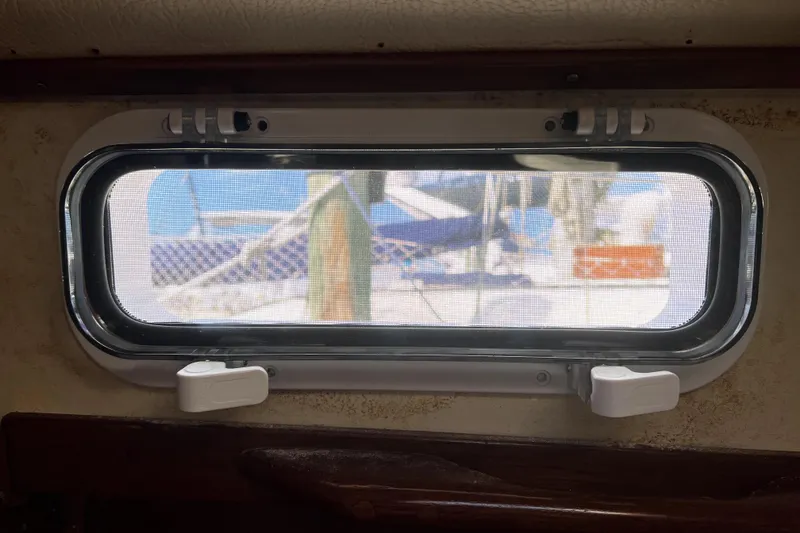 Slide: The Image of Portlight view from a 1986 Sabre 38 sailboat, showcasing exterior nautical elements. - 34