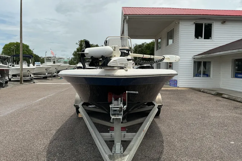 Slide: The Image of 2022 NauticStar 215 XTS Shallow Bay boat on trailer at dealership. - 5