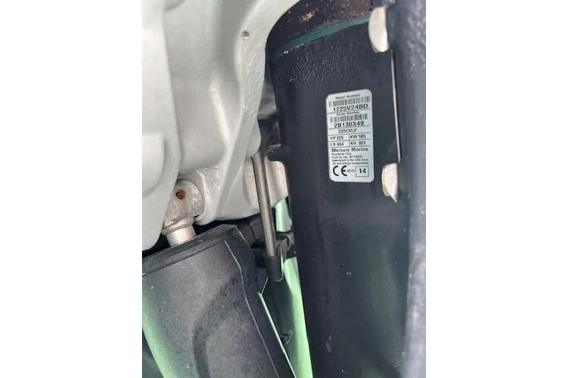 Slide: The Image of Close-up of a 2015 Boston Whaler 270 Vantage engine label and components. - 13
