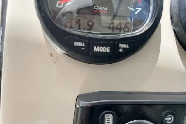 Slide: The Image of Close-up of 2015 Boston Whaler 270 Vantage RPM gauge displaying 11.9 volts and 446 hours. - 18